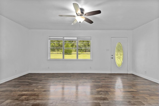 foyer entrance featuring baseboards, a ceiling fan, and wood finished floors
