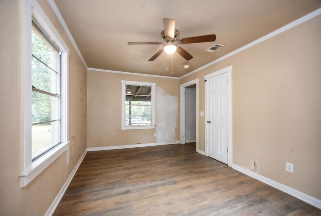 unfurnished room featuring dark hardwood / wood-style flooring and a healthy amount of sunlight