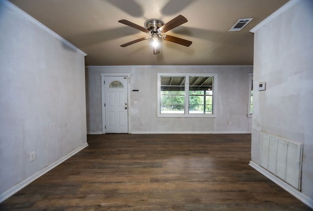 entrance foyer featuring ornamental molding, ceiling fan, and dark wood-type flooring