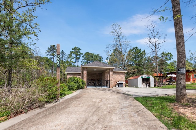 view of front of house with a storage shed