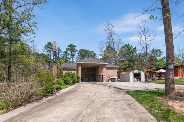 view of front of house with a storage shed