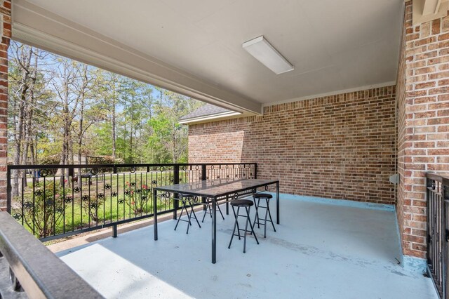 view of patio with a balcony