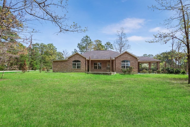 back of property featuring a yard