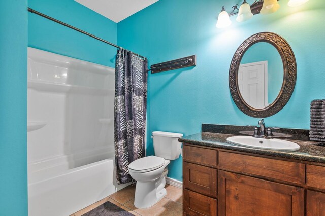 full bathroom featuring tile patterned flooring, shower / bath combination with curtain, vanity, and toilet