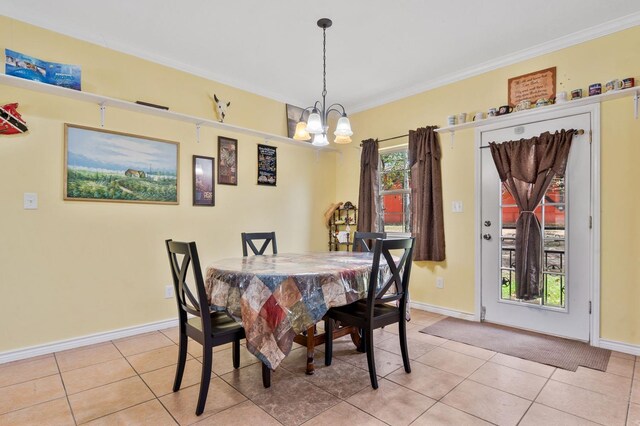 dining room featuring light tile patterned floors, an inviting chandelier, and ornamental molding