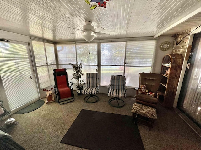 sunroom with ceiling fan and wood ceiling