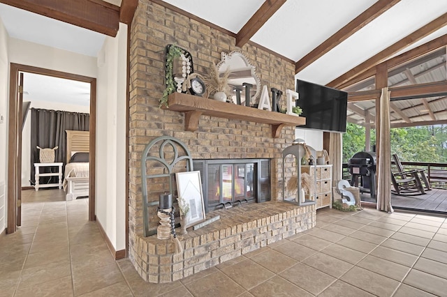 unfurnished living room featuring vaulted ceiling with beams, light tile patterned flooring, and a fireplace