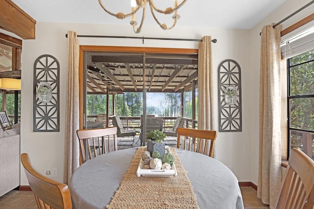 tiled dining room featuring a notable chandelier