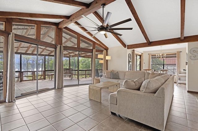 tiled living room featuring vaulted ceiling with beams and ceiling fan with notable chandelier