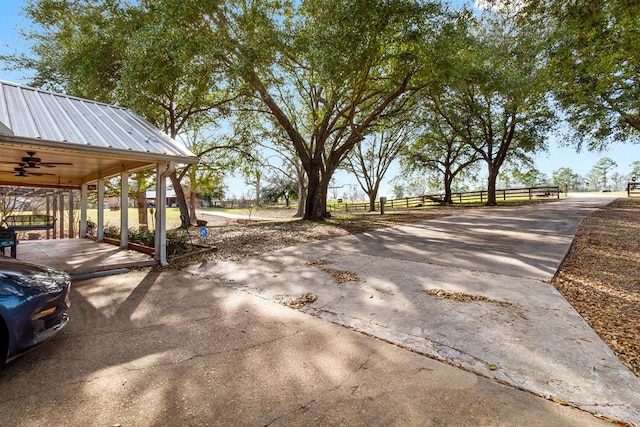 exterior space with ceiling fan