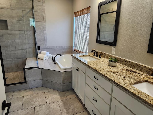 305 Acorn Dr, Lufkin, TX 75904 - full bathroom featuring a bath, a tile shower, double vanity, and tile patterned floors