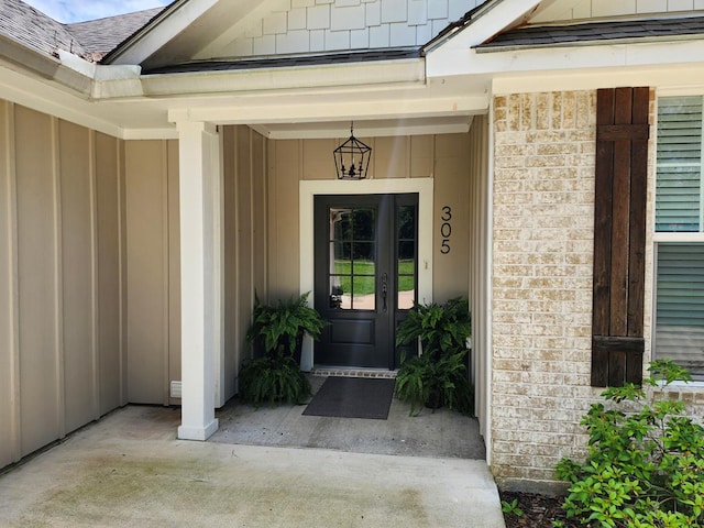 305 Acorn Dr, Lufkin, TX 75904 - doorway to property with board and batten siding and brick siding