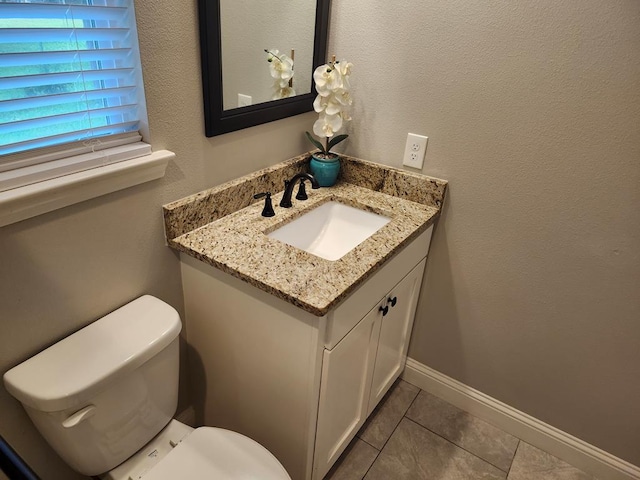 305 Acorn Dr, Lufkin, TX 75904 - bathroom with tile patterned flooring, toilet, and vanity