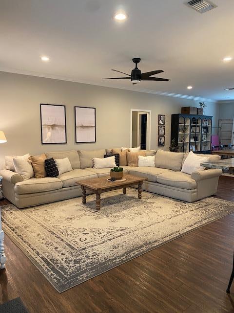 305 Acorn Dr, Lufkin, TX 75904 - living room with crown molding, recessed lighting, a ceiling fan, and dark wood-style flooring