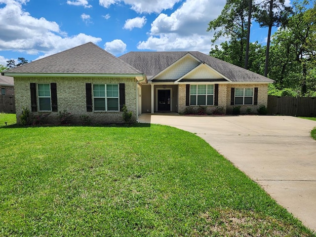 305 Acorn Dr, Lufkin, TX 75904 - view of front of home featuring driveway and brick siding