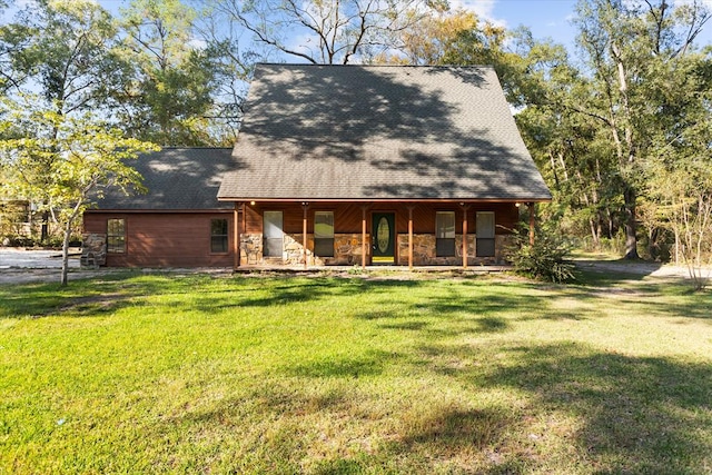 back of property featuring a lawn