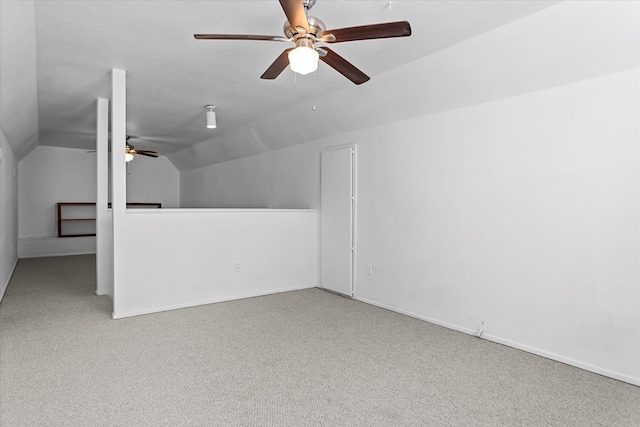 additional living space with carpet flooring, ceiling fan, and lofted ceiling