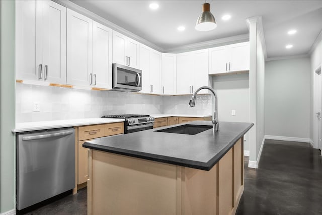 kitchen with backsplash, a kitchen island with sink, white cabinets, sink, and stainless steel appliances