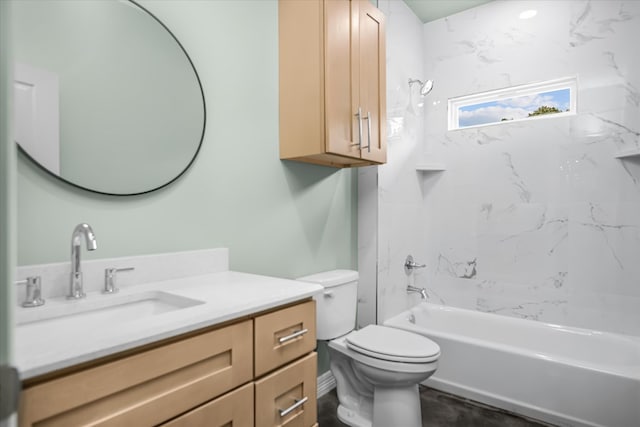 full bathroom featuring vanity, tiled shower / bath combo, and toilet