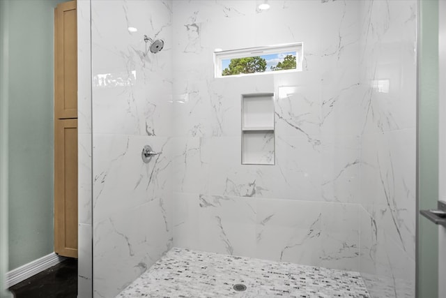 bathroom featuring tiled shower