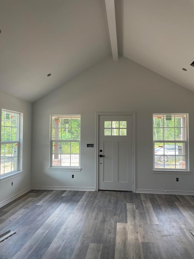 foyer featuring beam ceiling, high vaulted ceiling, and dark wood-type flooring