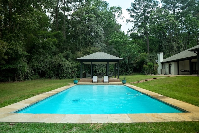 view of swimming pool featuring a gazebo, a yard, and central AC unit