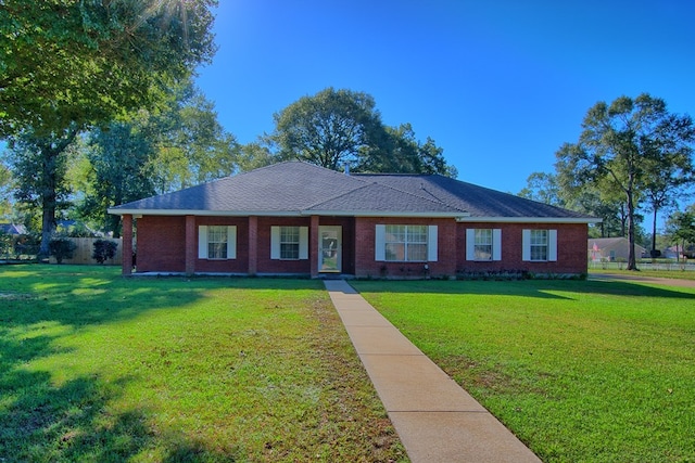 ranch-style house featuring a front lawn