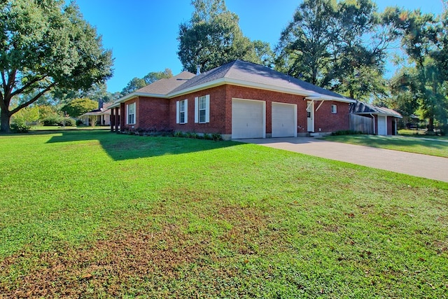 view of front facade with a front yard and a garage