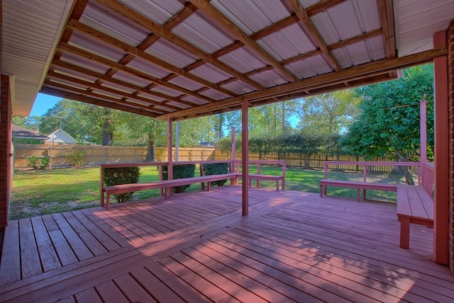 wooden deck featuring a yard