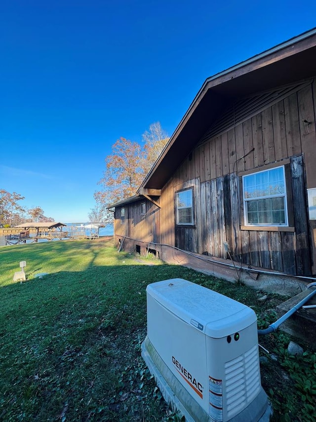 view of side of property featuring a yard