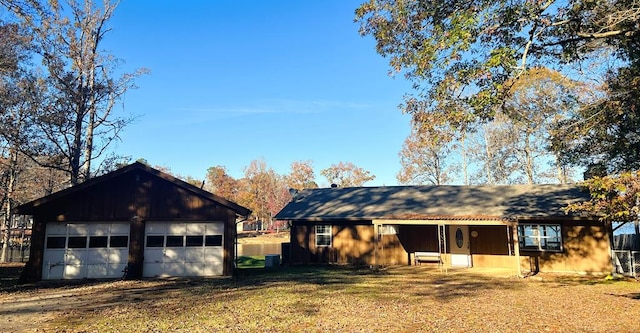 view of front of home with a garage and a front yard