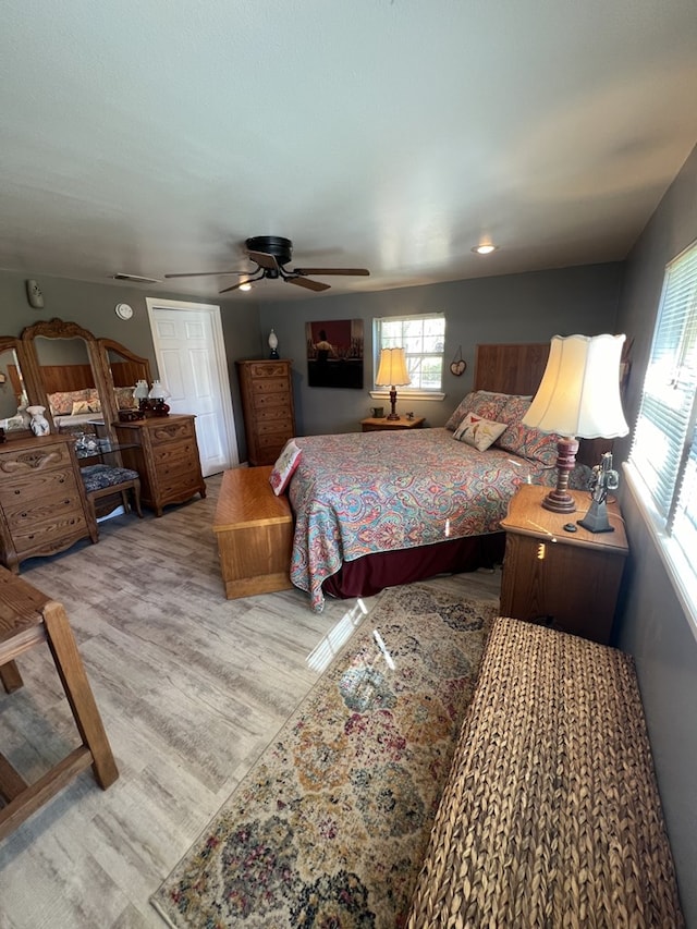 bedroom featuring ceiling fan and light wood-type flooring