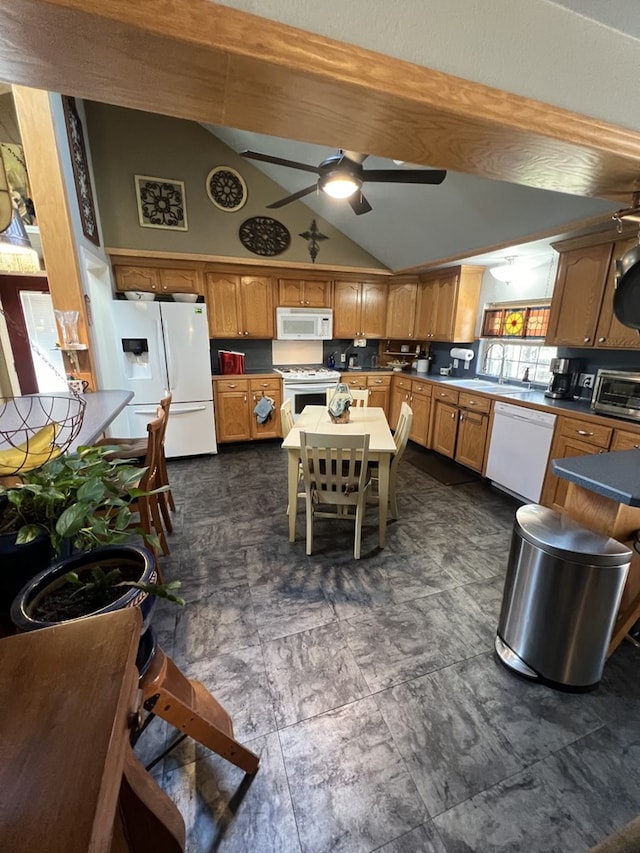 kitchen featuring white appliances, ceiling fan, and lofted ceiling