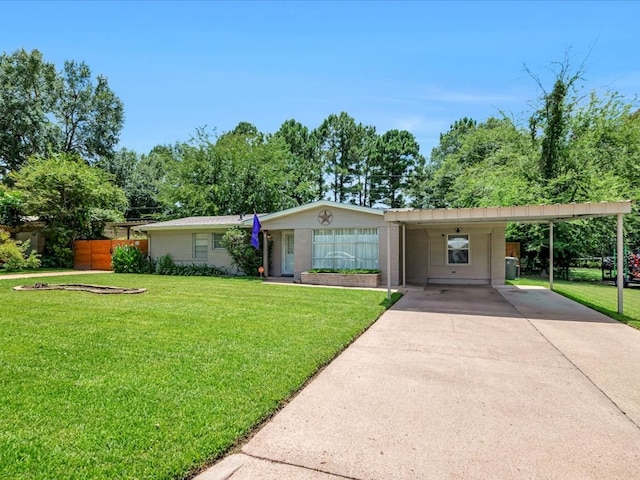 1318 Sue Dr, Lufkin, TX 75901 - ranch-style house featuring driveway, a front lawn, an attached carport, and brick siding