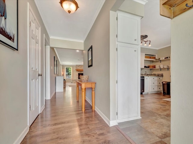 1318 Sue Dr, Lufkin, TX 75901 - hallway with ornamental molding and light wood-type flooring