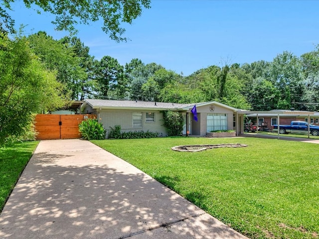 1318 Sue Dr, Lufkin, TX 75901 - view of front of house with driveway and a gate