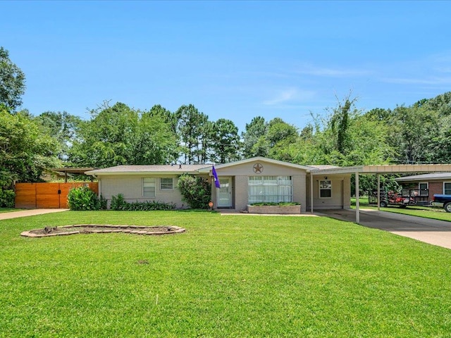 1318 Sue Dr, Lufkin, TX 75901 - ranch-style home with concrete driveway and a carport