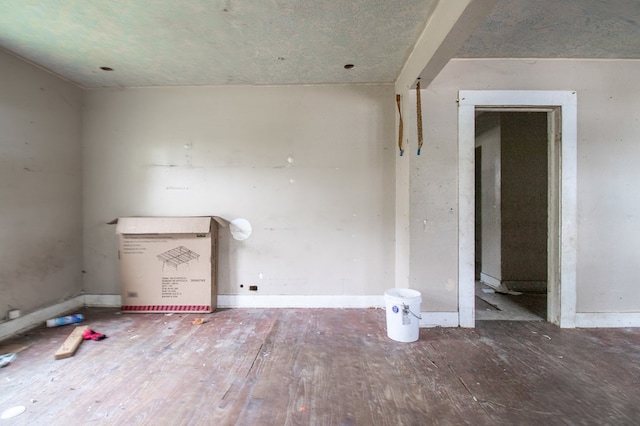 spare room with wood-type flooring