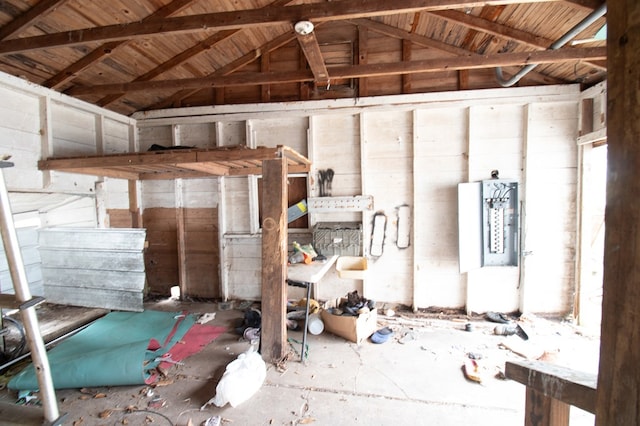 miscellaneous room with lofted ceiling with beams