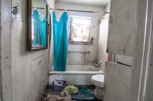 bathroom with shower / bath combo and toilet