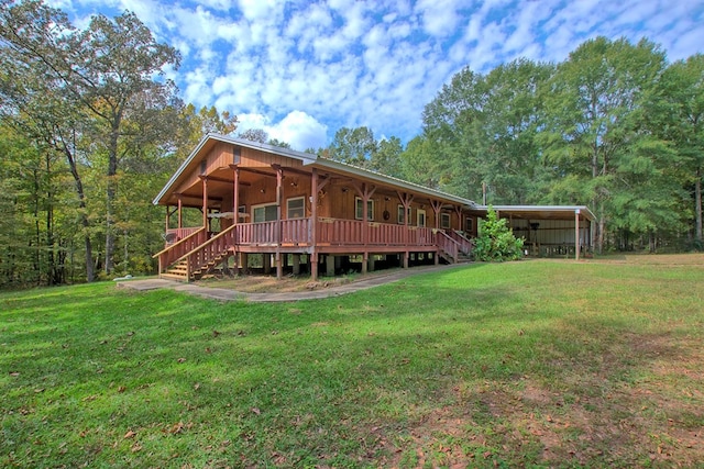360 Oak Hill Rd, Hemphill, TX 75951 - rear view of house featuring a lawn, stairway, and a carport