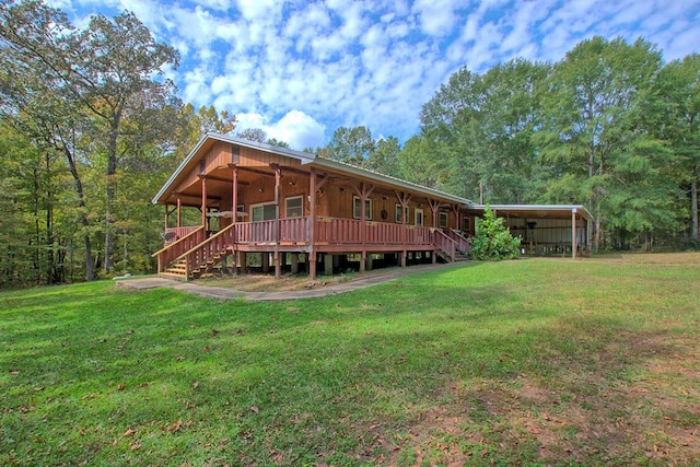 360 Oak Hill Rd, Hemphill, TX 75951 - back of house featuring a lawn, stairway, a ceiling fan, and a carport