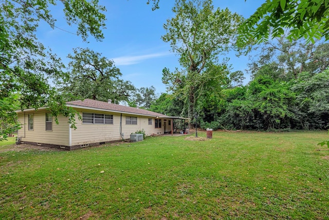 view of yard with a patio area and central AC unit