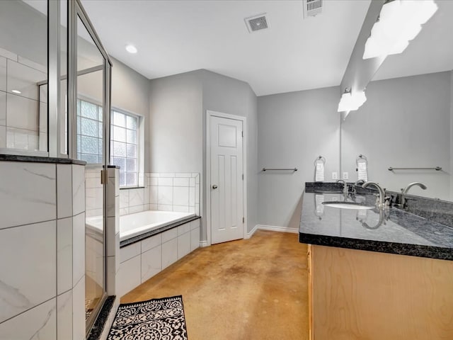 bathroom featuring vanity and independent shower and bath