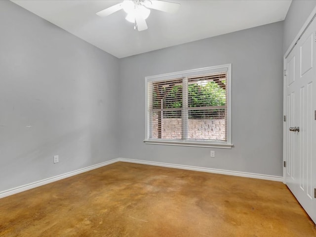 spare room featuring ceiling fan and carpet floors