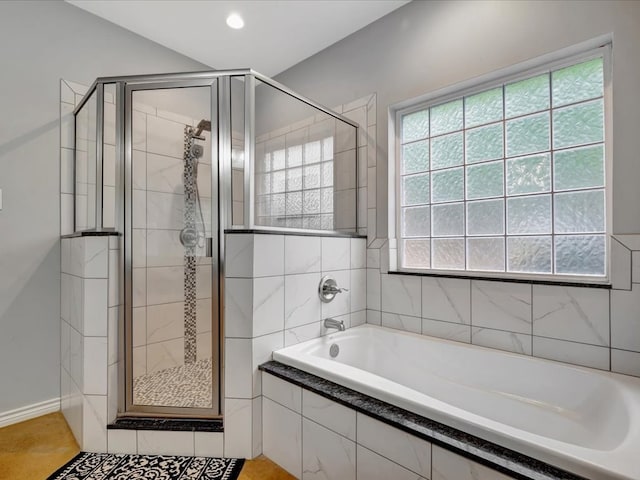 bathroom featuring tile patterned floors and plus walk in shower