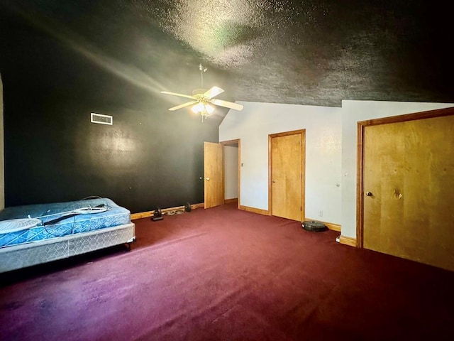 179 County Road 4587, Spurger, TX 77660 - bedroom with lofted ceiling, carpet, baseboards, and a ceiling fan