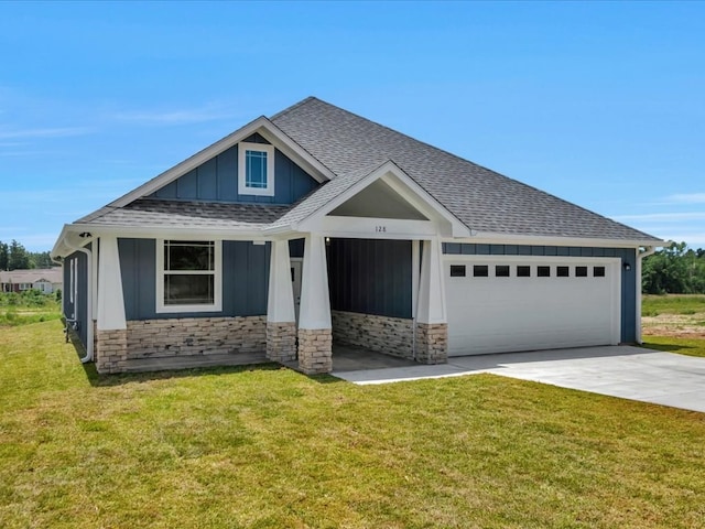 128 Stoney Rdg, Lufkin, TX 75904 - craftsman-style house featuring roof with shingles, an attached garage, driveway, board and batten siding, and a front yard
