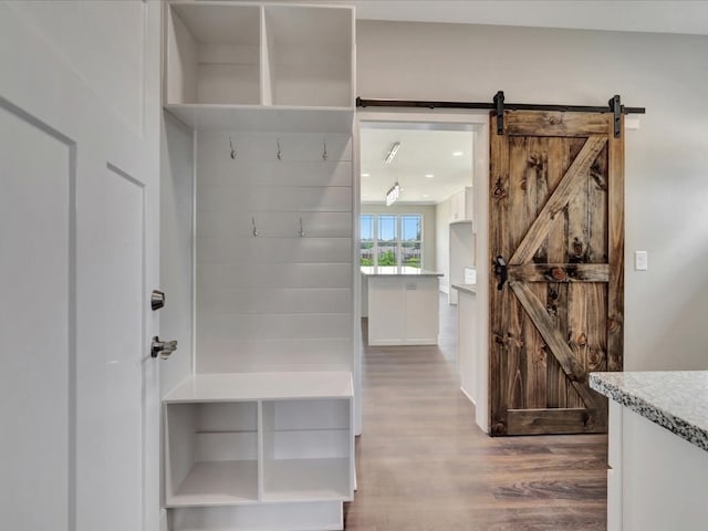 128 Stoney Rdg, Lufkin, TX 75904 - mudroom featuring wood finished floors and a barn door