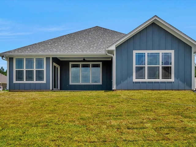 128 Stoney Rdg, Lufkin, TX 75904 - rear view of property featuring board and batten siding, a lawn, and a shingled roof